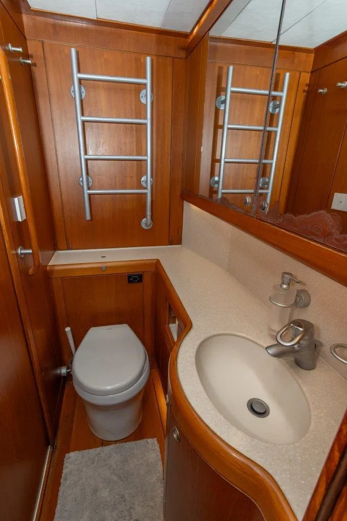 Slide: The Image of Luxurious bathroom in 2003 Nautor Swan 100 Pilothouse yacht with wooden cabinetry and modern fixtures. - 46