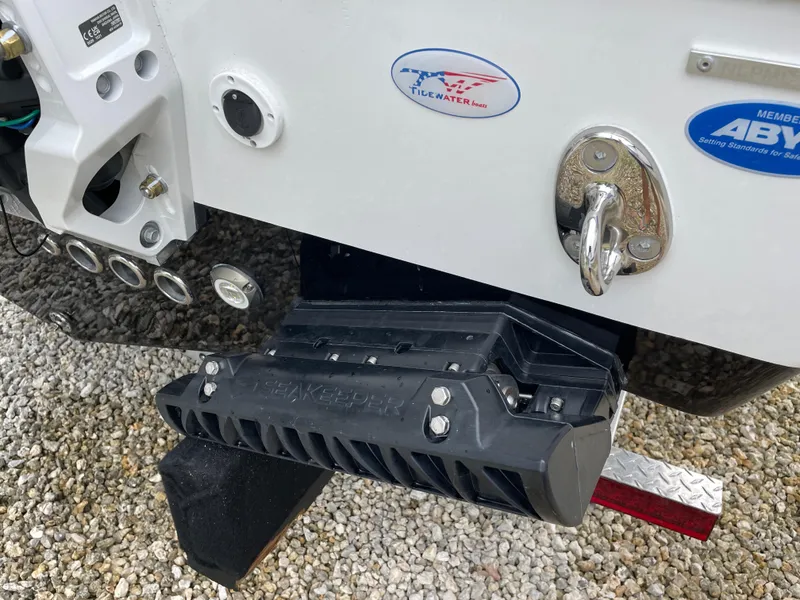 Slide: The Image of 2026 Tidewater 256 CC Adventure boat stern with Seakeeper stabilizer and ABYC member badge. - 31