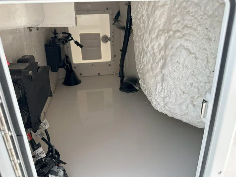 Slide: The Image of 2025 Tidewater 320 CC Adventure boat interior with speakers and sleek white design. - 25