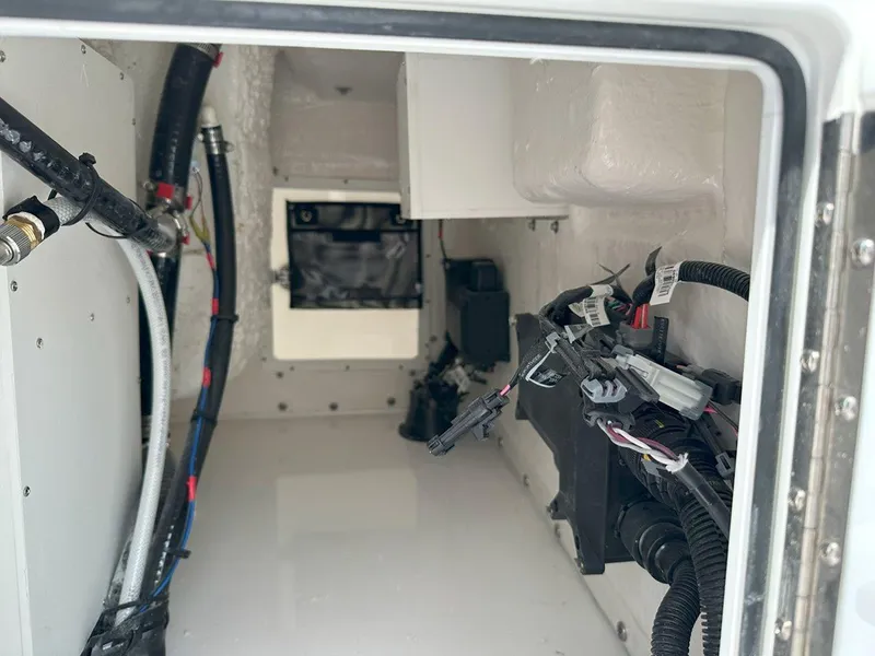 Slide: The Image of 2025 Tidewater 320 CC Adventure boat with waste disposal warning sign. - 26