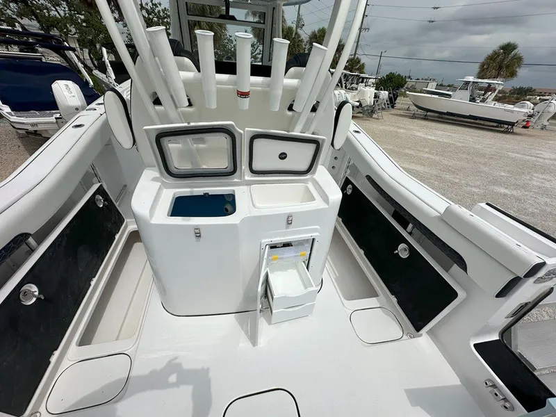 Slide: The Image of 2025 Tidewater 320 CC Adventure boat interior with control panel and portholes. - 28