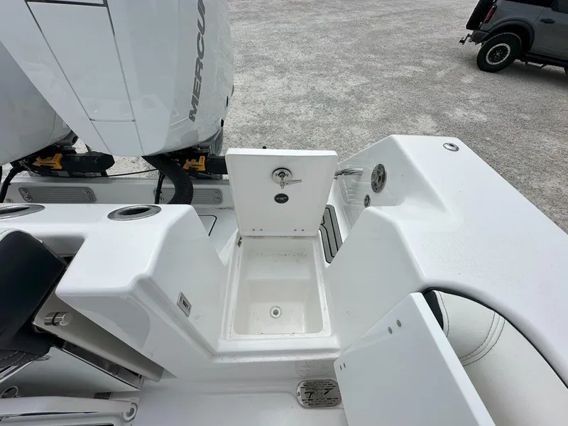 Slide: The Image of 2025 Tidewater 320 CC Adventure cabin interior with cushioned seating and storage compartments. - 30