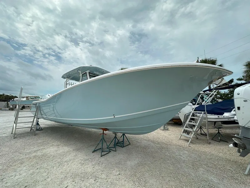 Slide: The Image of 2025 Tidewater 320 CC Adventure boat interior with speakers and cup holders. - 34