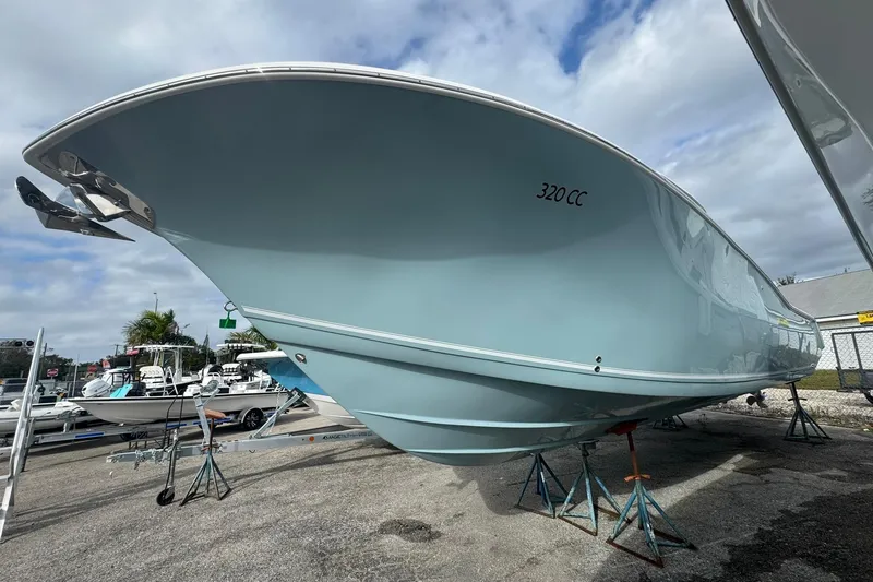 Slide: The Image of 2025 Tidewater 320 CC Adventure boat with ABYC member sticker and metal hook. - 39