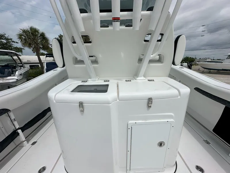 Slide: The Image of 2025 Tidewater 320 CC Adventure boat with dual Mercury engines, spacious deck layout. - 8