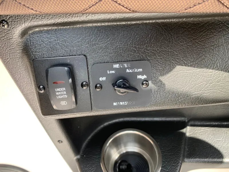 Slide: The Image of Control panel of a 2014 Regal 27 FasDeck boat with underwater lights and heater settings. - 11