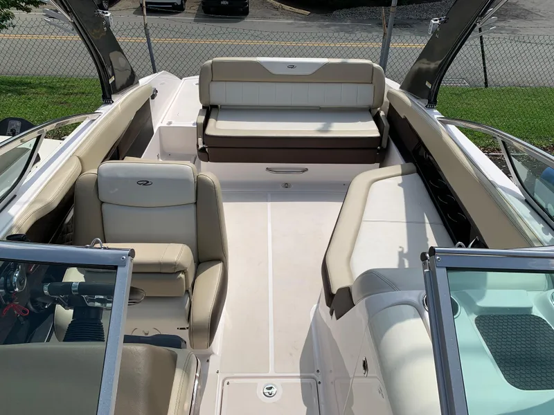 Slide: The Image of 2014 Regal 27 FasDeck boat interior with beige seating and modern design. - 3
