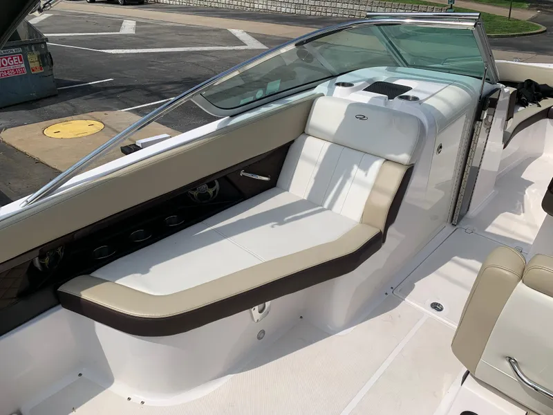 Slide: The Image of 2014 Regal 27 FasDeck boat interior with beige seating and sleek design. - 4