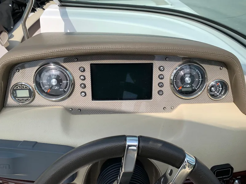 Slide: The Image of Dashboard of a 2014 Regal 27 FasDeck boat with gauges and controls. - 8