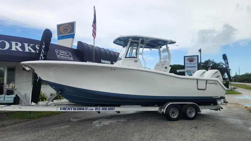 The Image of 2026 Tidewater 282 CC Adventure boat on trailer at dealership. - 0