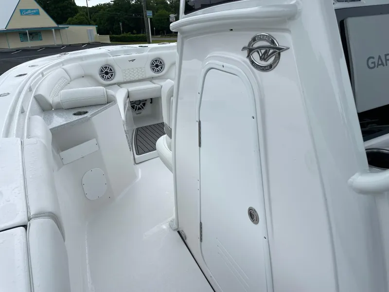 Slide: The Image of 2026 Tidewater 282 CC Adventure boat interior with seating and storage compartments. - 13