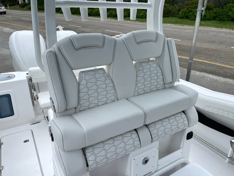 Slide: The Image of 2026 Tidewater 282 CC Adventure boat with luxurious white seating and modern design. - 16