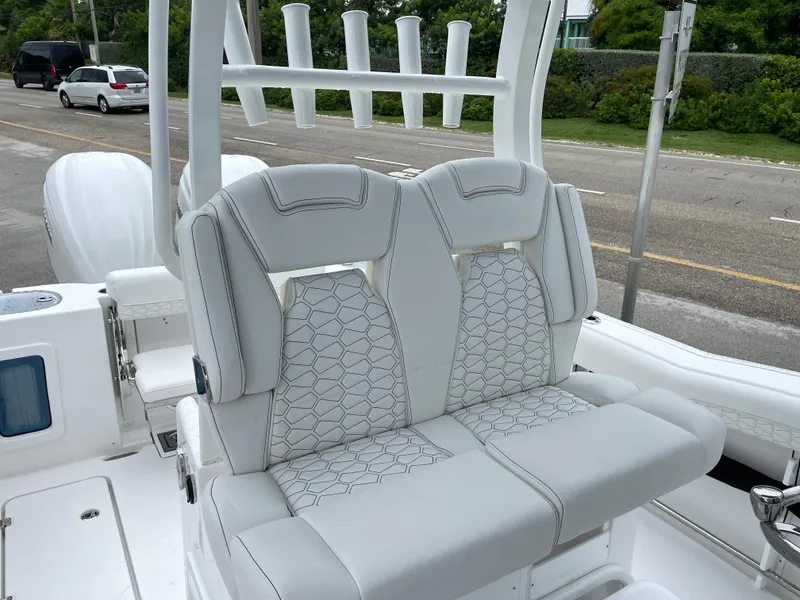 Slide: The Image of 2026 Tidewater 282 CC Adventure boat with luxurious seating and rod holders. - 17