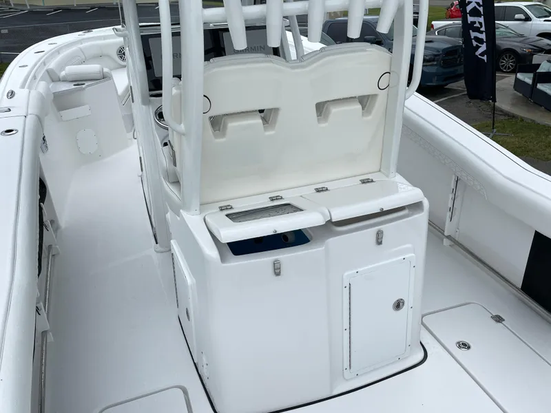Slide: The Image of 2026 Tidewater 282 CC Adventure boat interior with seating and storage compartments. - 19