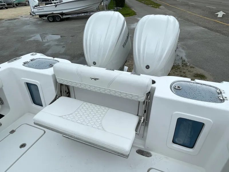 Slide: The Image of 2026 Tidewater 282 CC Adventure boat with dual Yamaha engines and white seating. - 27