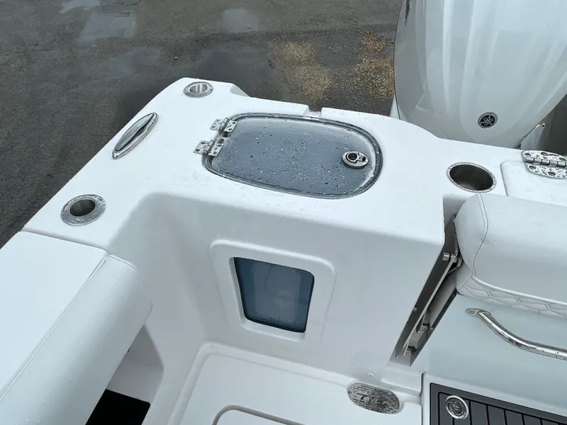 Slide: The Image of 2026 Tidewater 282 CC Adventure boat deck with storage and seating. - 28