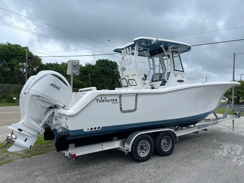 Slide: The Image of 2026 Tidewater 282 CC Adventure boat on trailer, featuring Yamaha outboard motor. - 3
