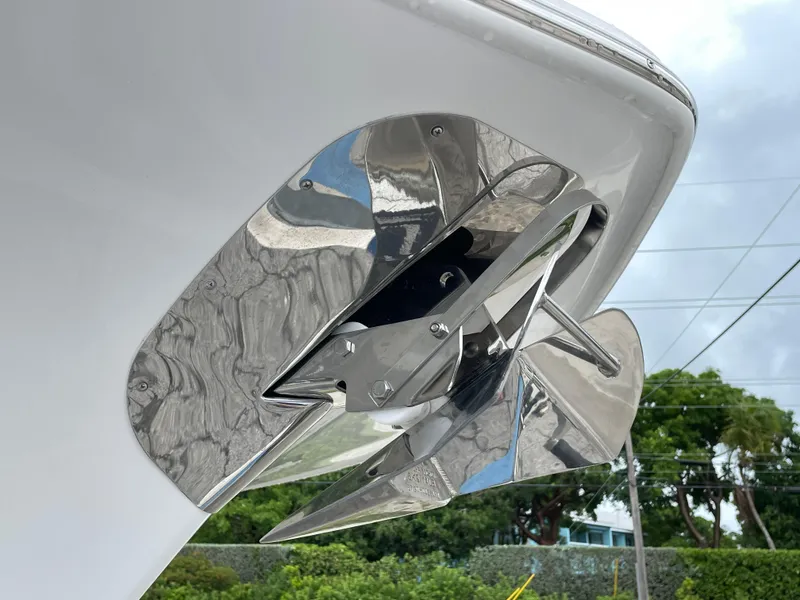 Slide: The Image of Stainless steel anchor on 2026 Tidewater 282 CC Adventure boat, against cloudy sky backdrop. - 35