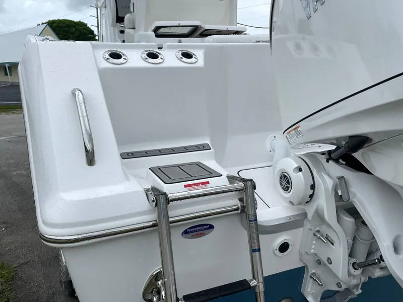 Slide: The Image of 2026 Tidewater 282 CC Adventure boat with Yamaha engine and swim ladder. - 36