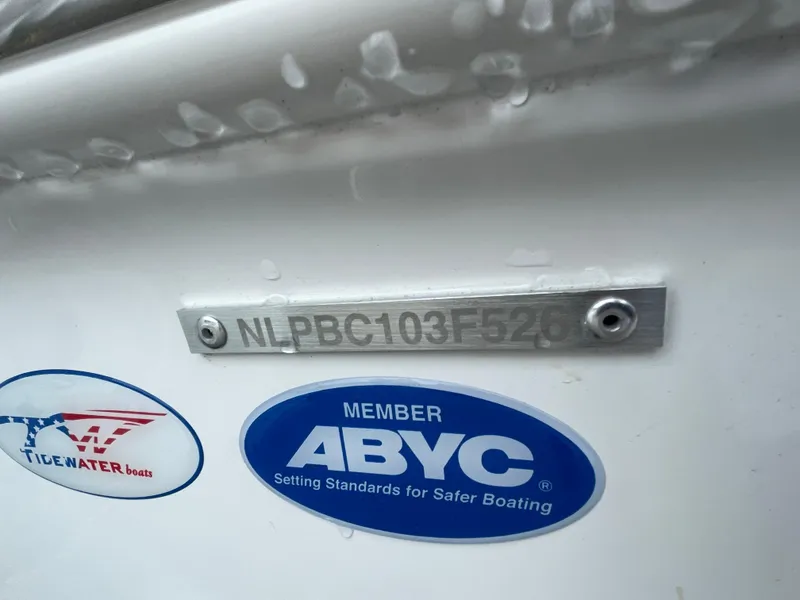 Slide: The Image of 2026 Tidewater 282 CC Adventure boat identification plate with ABYC membership sticker. - 38