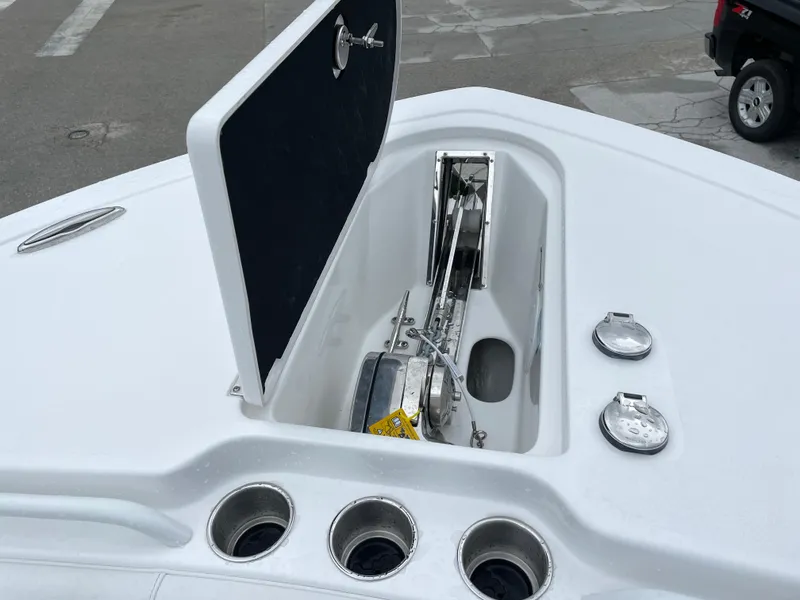 Slide: The Image of 2026 Tidewater 282 CC Adventure boat anchor compartment with open hatch. - 4