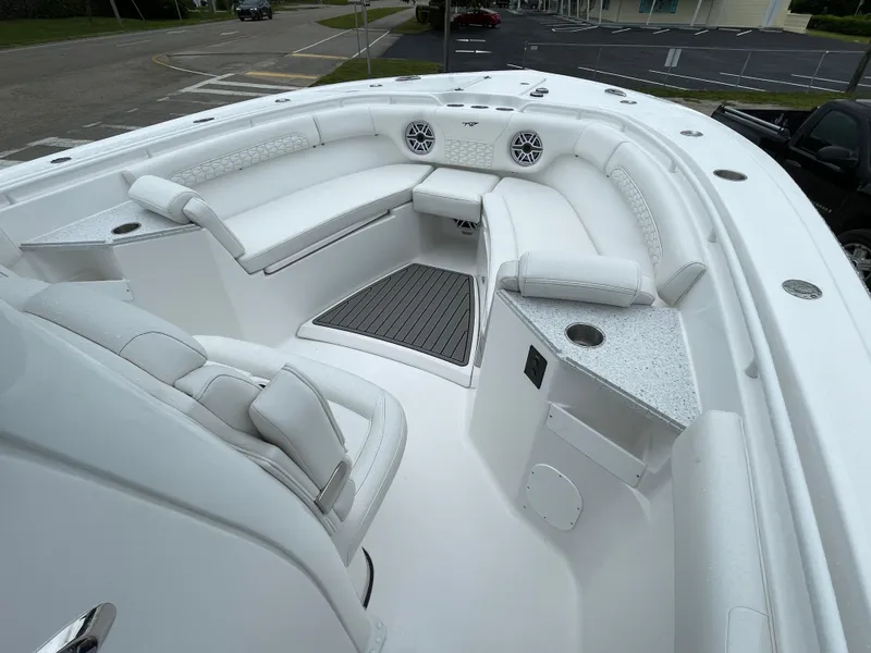 Slide: The Image of 2026 Tidewater 282 CC Adventure boat interior with white seating and modern design. - 5