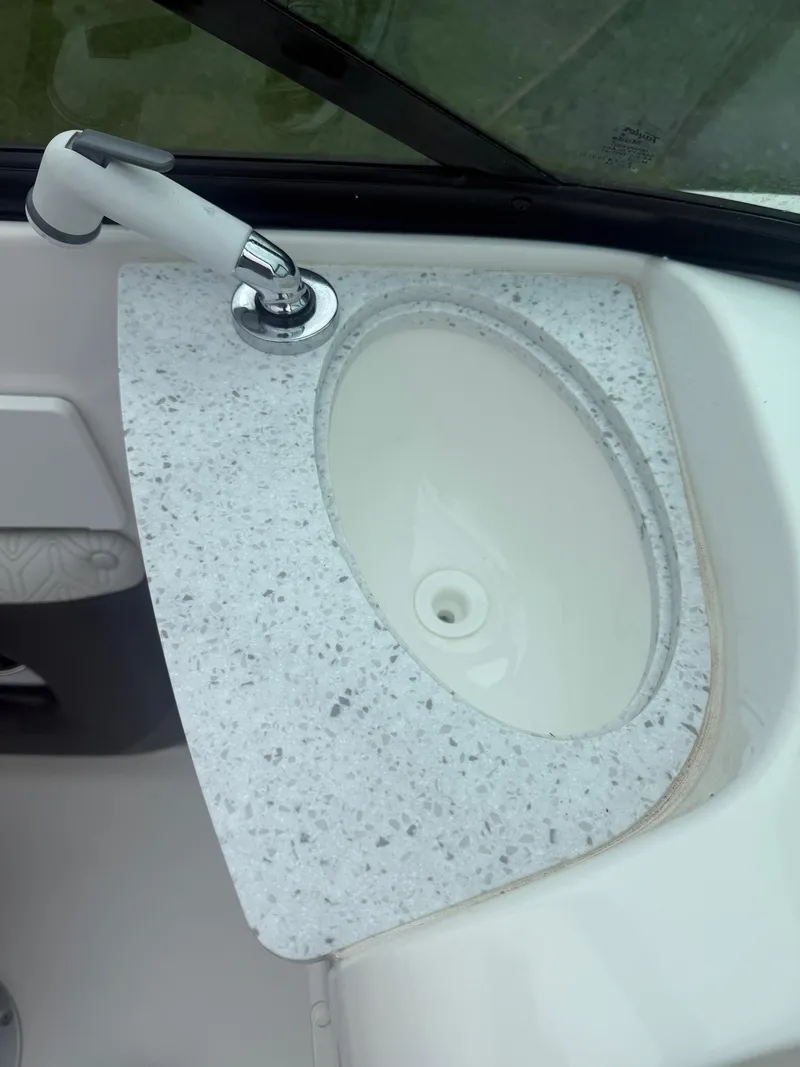Slide: The Image of Marble countertop with sink and faucet in 2022 Hurricane SD 2486 boat. - 14