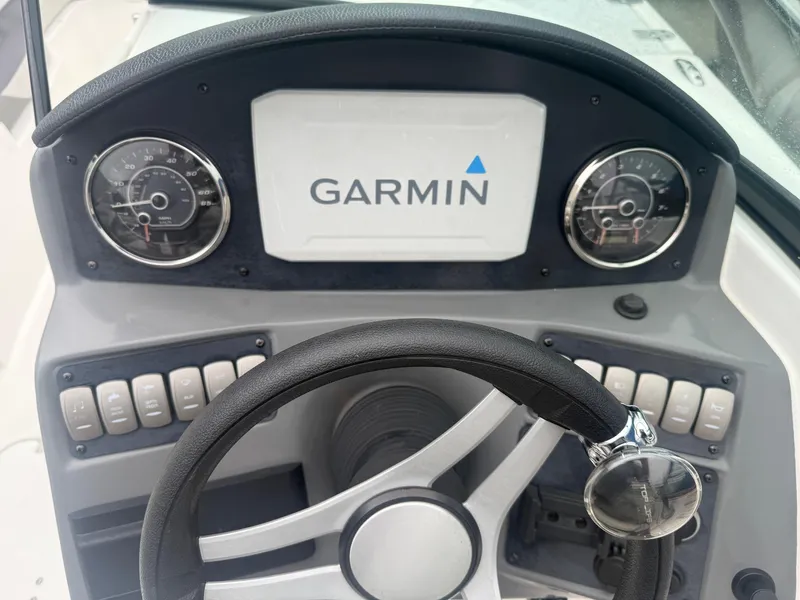 Slide: The Image of Dashboard of 2022 Hurricane SD 2486 boat with Garmin display and steering wheel. - 15