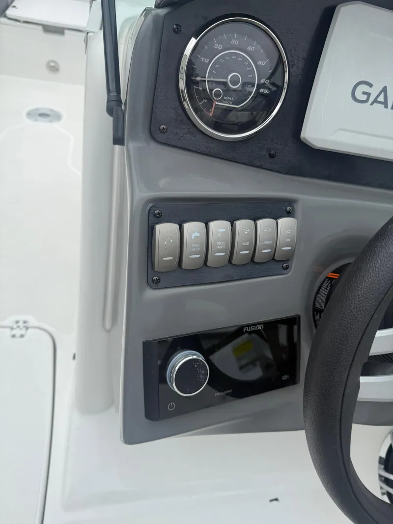Slide: The Image of Control panel of 2022 Hurricane SD 2486 boat with speedometer and switches. - 17