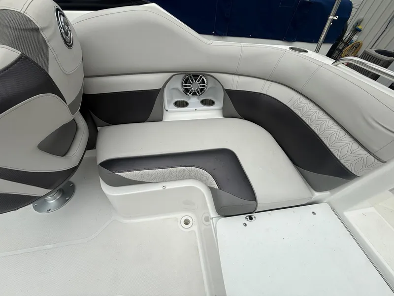 Slide: The Image of 2022 Hurricane SD 2486 boat interior with gray seating and speaker system. - 20