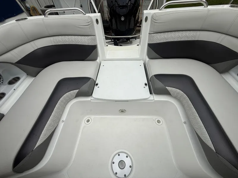 Slide: The Image of 2022 Hurricane SD 2486 boat interior with gray seating and storage area. - 21