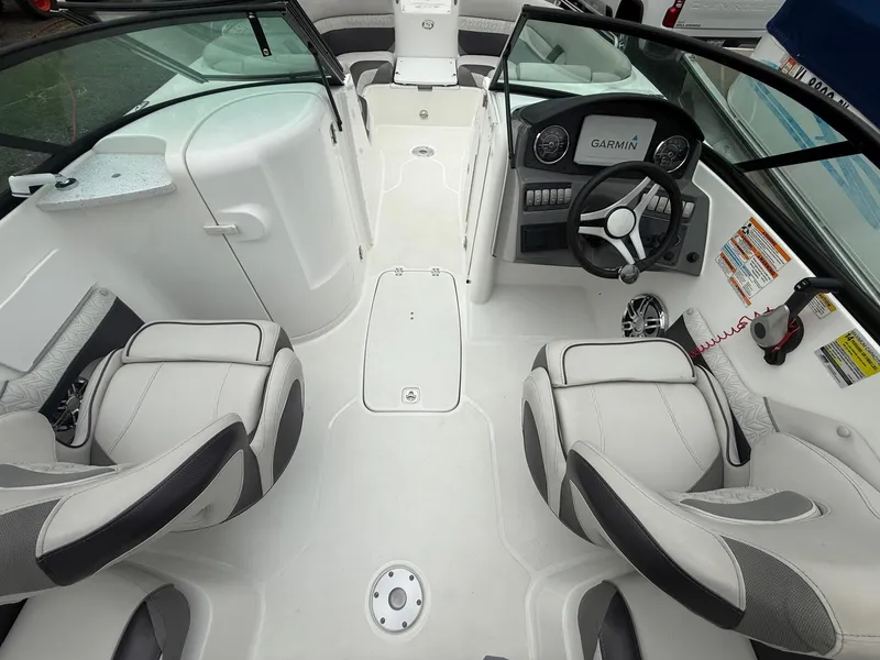 Slide: The Image of 2022 Hurricane SD 2486 boat interior with Garmin dashboard and plush seating. - 25