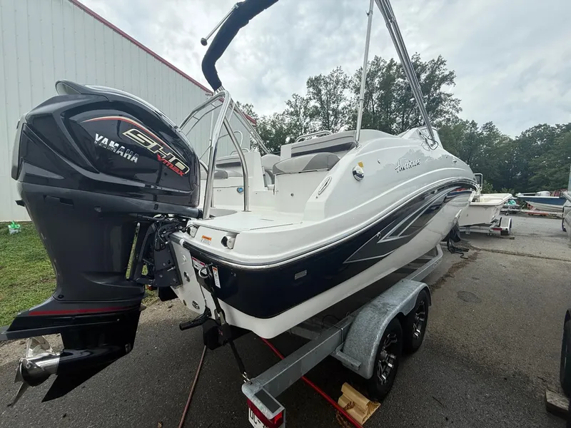 Slide: The Image of 2022 Hurricane SD 2486 boat with Yamaha engine on trailer, parked outdoors. - 32