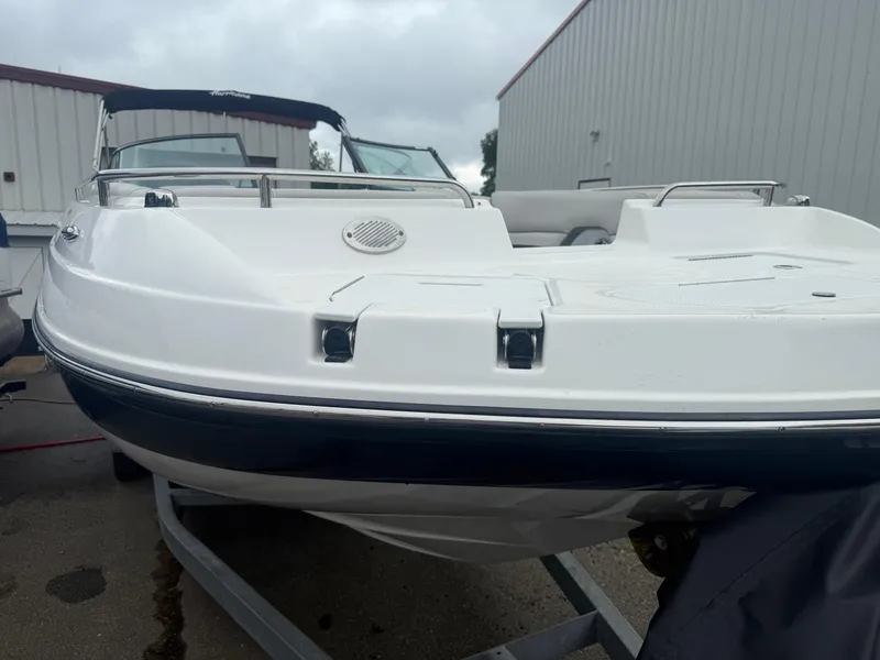 Slide: The Image of 2022 Hurricane SD 2486 boat on trailer, white hull, overcast sky background. - 35