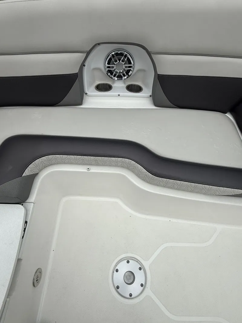 Slide: The Image of Interior of a 2022 Hurricane SD 2486 boat, featuring seating and speaker system. - 7