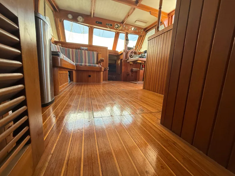 Slide: The Image of Interior of 1981 DeFever Passagemaker with polished wood flooring and nautical decor. - 25