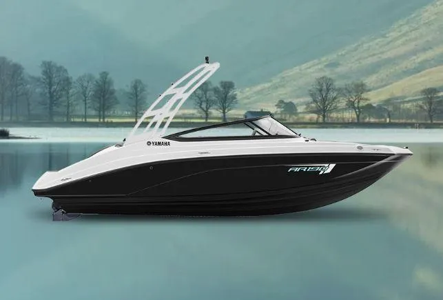 The Image of 2025 Yamaha Boats AR190 on serene lake with scenic mountain backdrop. - 1