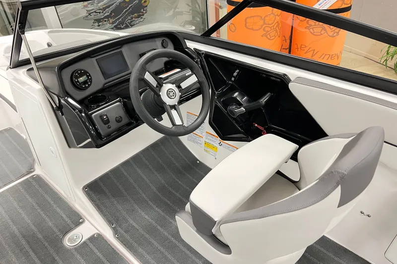 Slide: The Image of 2025 Yamaha Boats AR190 cockpit with steering wheel and dashboard controls. - 10