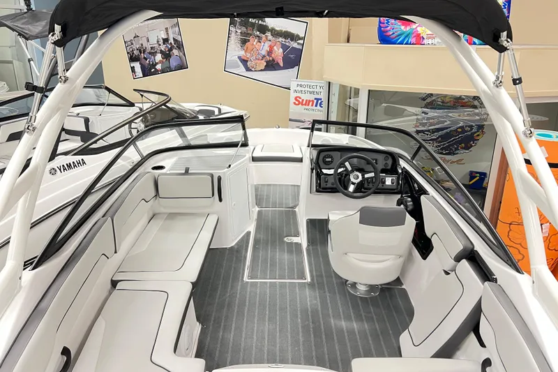 Slide: The Image of 2025 Yamaha Boats AR190 interior with sleek seating and modern dashboard design. - 11