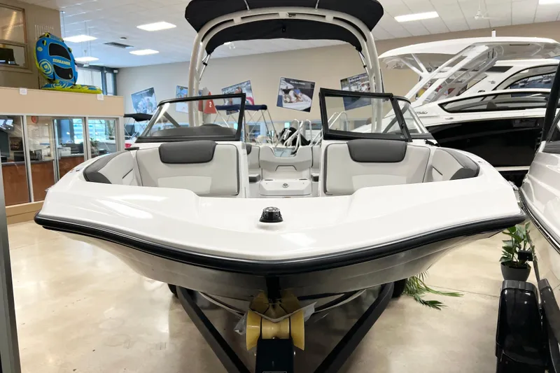 Slide: The Image of 2025 Yamaha Boats AR190 in showroom, sleek white design, modern interior, and stylish features. - 3