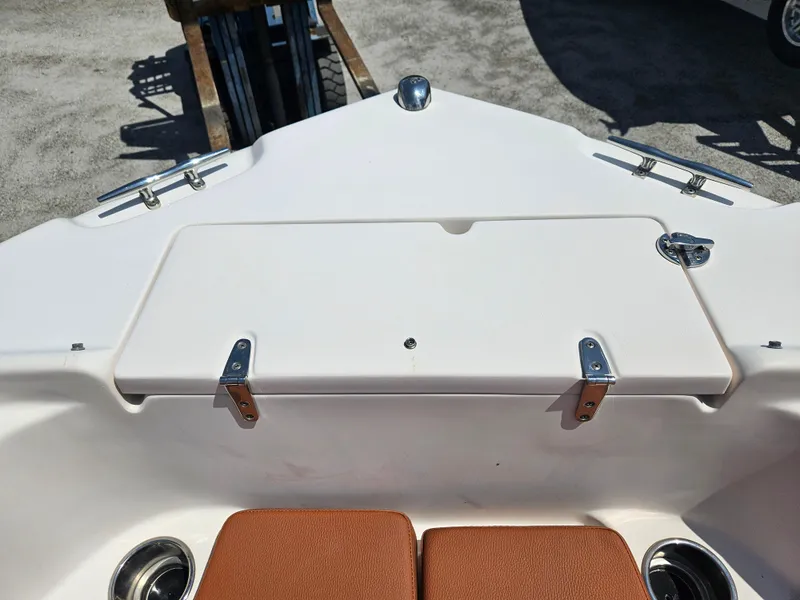 Slide: The Image of 2012 Grady-White Freedom 205 boat interior with storage compartment and seating. - 15