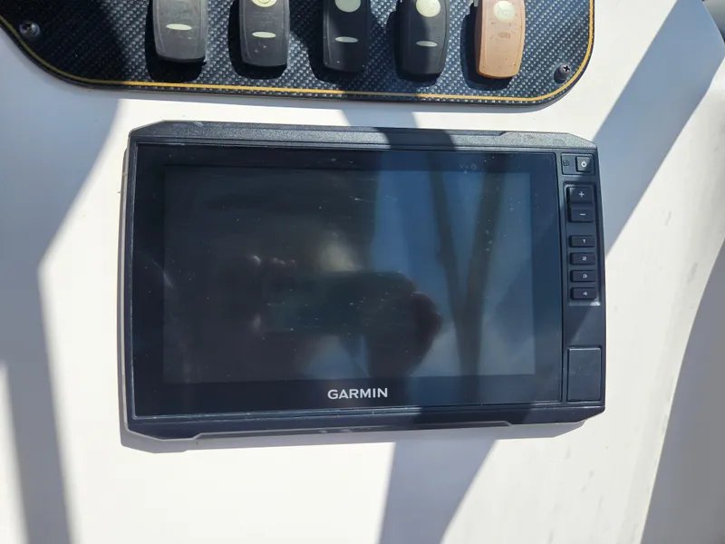 Slide: The Image of Garmin navigation system on 2012 Grady-White Freedom 205 boat dashboard. - 19