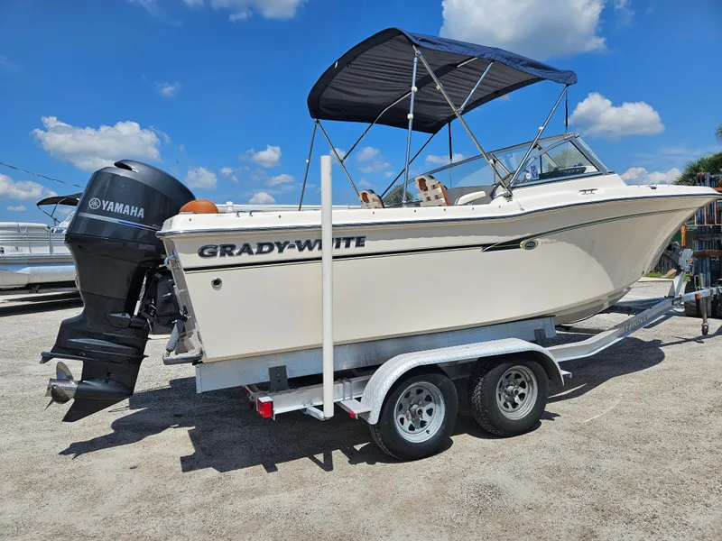 Slide: The Image of 2012 Grady-White Freedom 205 boat on trailer with Yamaha outboard motor. - 2