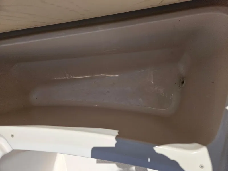 Slide: The Image of Interior compartment of a 2012 Grady-White Freedom 205 boat, showing storage space. - 25