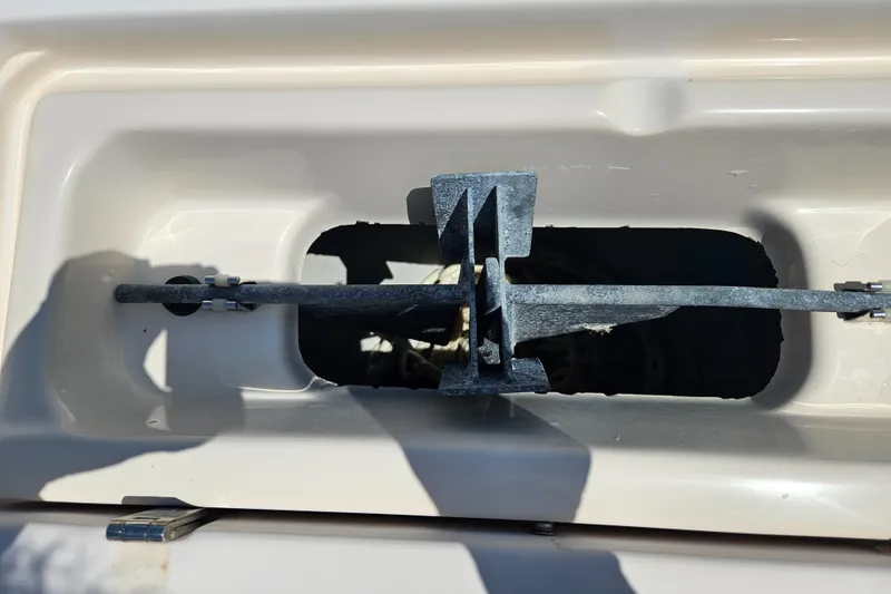 Slide: The Image of Close-up of a 2012 Grady-White Freedom 205 boat component, showing a metal latch mechanism. - 26