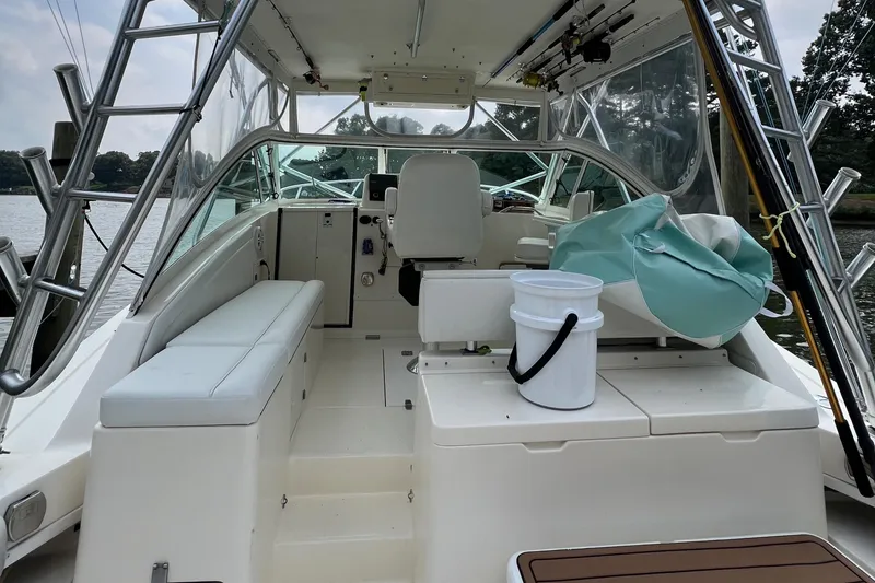 Slide: The Image of 2004 Albemarle 310 Express Fisherman boat interior with seating and fishing gear. - 14