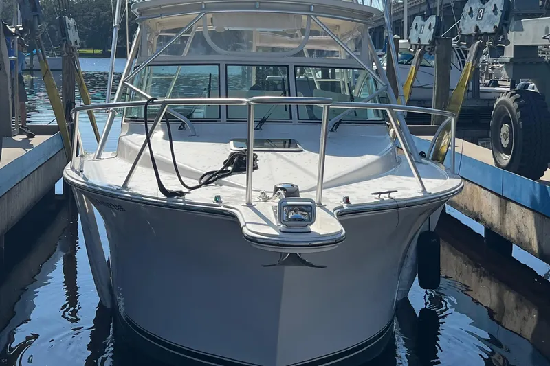 Slide: The Image of 2004 Albemarle 310 Express Fisherman boat docked in marina. - 16