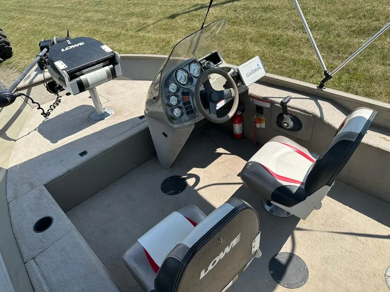 Slide: The Image of 2007 Lowe Fishing Machine FM165S interior with steering console and seating. - 11