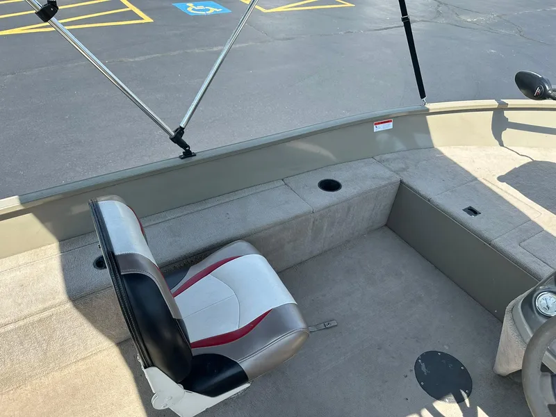 Slide: The Image of 2007 Lowe Fishing Machine FM165S interior with seating and fishing rod holders. - 13