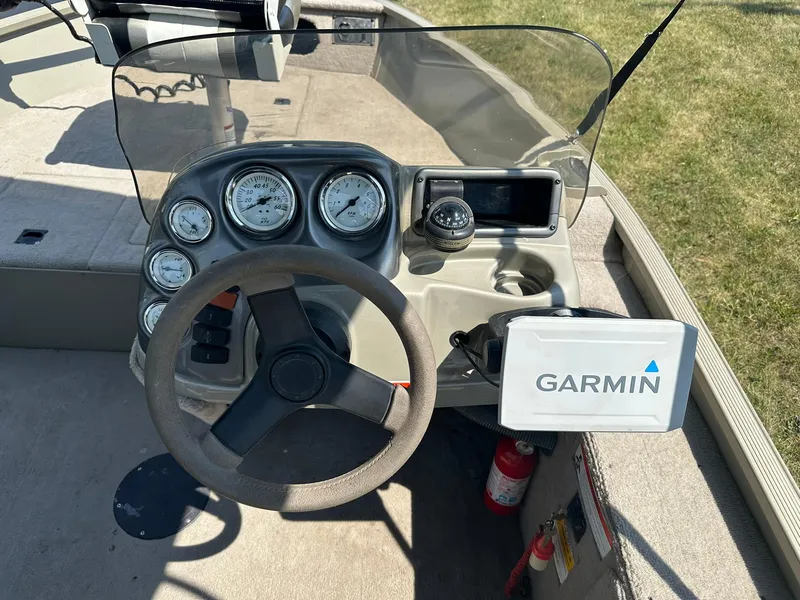 Slide: The Image of 2007 Lowe Fishing Machine FM165S dashboard with Garmin GPS and gauges. - 14